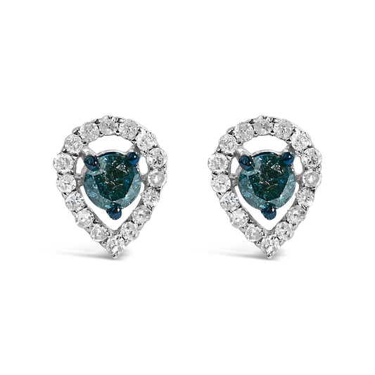 Pair of white metal teardrop-shaped earrings with round blue gemstones prong-set in the center, surrounded by a halo of round white gemstones, shown in a close-up front angle on a white background.