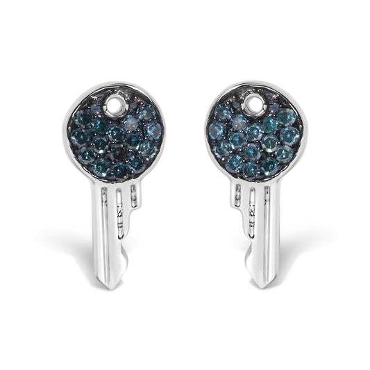 Close-up front view of a pair of white metal earrings shaped like keys with round blue gemstones set in a circle at the top.