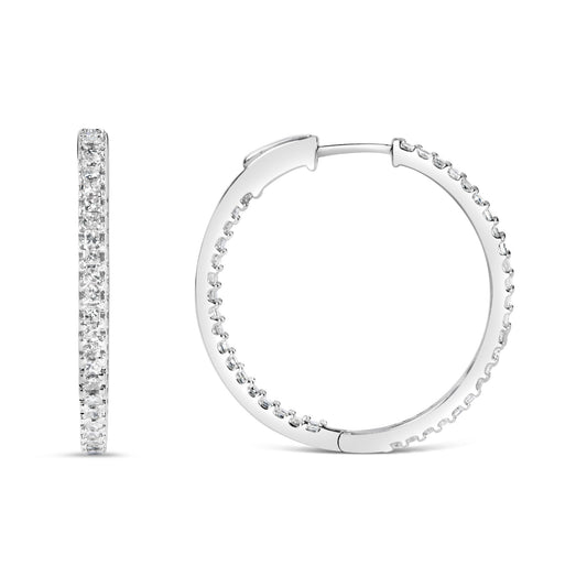 Pair of white metal hoop earrings with white princess-shaped gemstones in prong settings, shown from side and front angles.