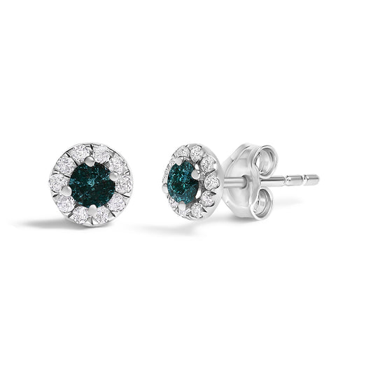 Pair of white metal round stud earrings shown from a front and side angle, each featuring a central blue round gemstone in four-prong settings surrounded by smaller white round gemstones in prong settings.