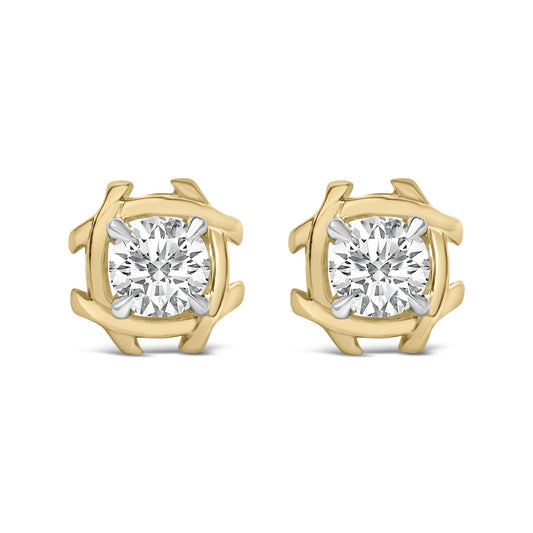 Close-up front view of a pair of earrings with round white gemstones in prong settings, surrounded by an abstract yellow metal frame.