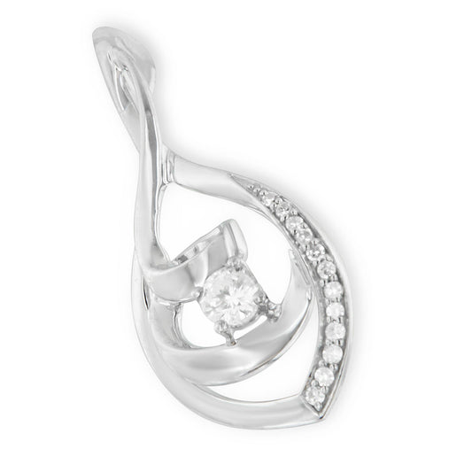 Close-up angled view of a white metal necklace pendant featuring a central round white gemstone in prong setting, surrounded by a swirl design with multiple small round white gemstones in prong settings.