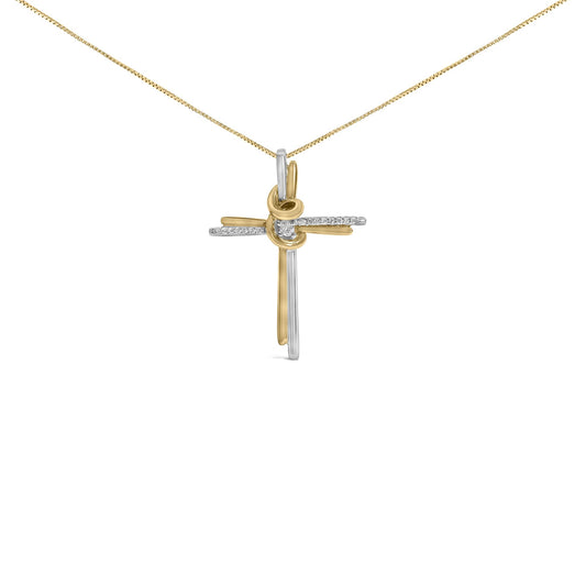 Front-facing shot of a two-toned cross necklace pendant with a knot detail at the center, adorned with one round white gemstone in the middle and a row of small round white gemstones along the horizontal bar, hanging from a chain.