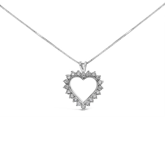 Front-facing image of a white metal heart-shaped necklace pendant with round white gemstones in a miracle setting around the perimeter.