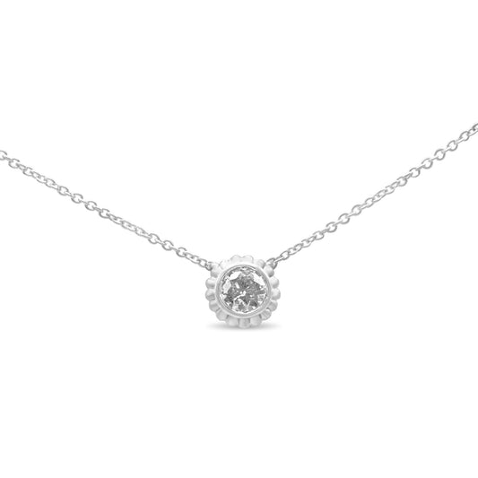 Front view of a white metal necklace with a round white gemstone in a bezel setting pendant.