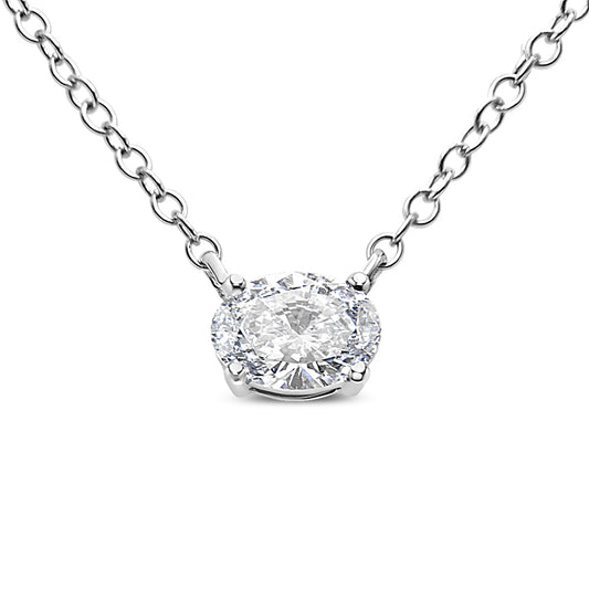 Close-up front view of a white necklace featuring a single oval-shaped white gemstone set in a four-prong setting on a delicate linked chain.