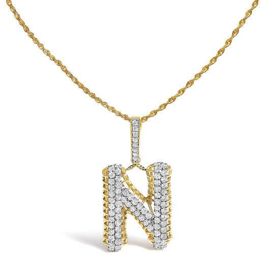 Close-up front view of a yellow metal twisted chain necklace with a pendant in the shape of the letter N encrusted with white round gemstones in a pave setting.