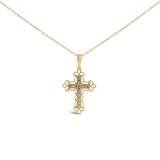 Front-facing shot of a yellow metal cross necklace pendant with round brownish prong-set gemstones arranged in a vertical and horizontal line, surrounded by ornate metalwork.