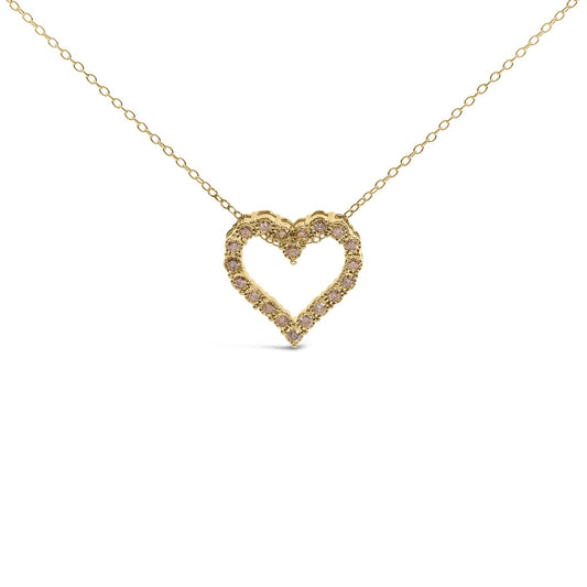 Front view of yellow metal necklace with heart-shaped pendant set with round brownish gemstones.