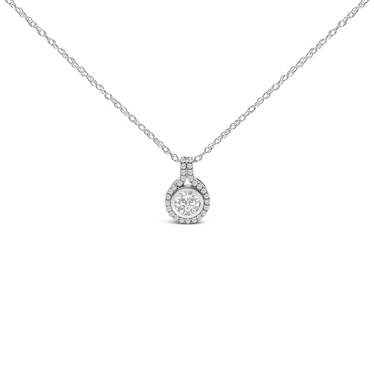 Front view of a white metal necklace with a round pendant featuring a central white gemstone surrounded by smaller white gemstones in prong settings, displayed on a white background.