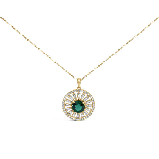 Close-up front-facing view of a yellow metal necklace with a round pendant featuring a central green gemstone surrounded by alternating white baguette and round gemstones.