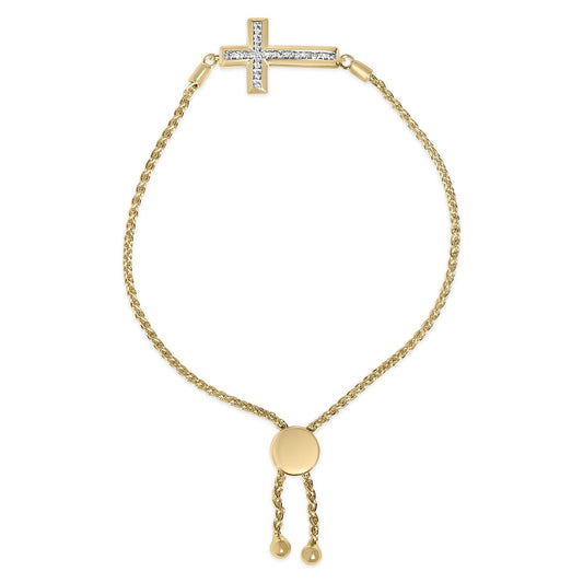 Close-up front view of a yellow metal bracelet with a horizontal cross adorned with white gemstones in pave setting, featuring a sliding adjustable clasp with two chain ends.