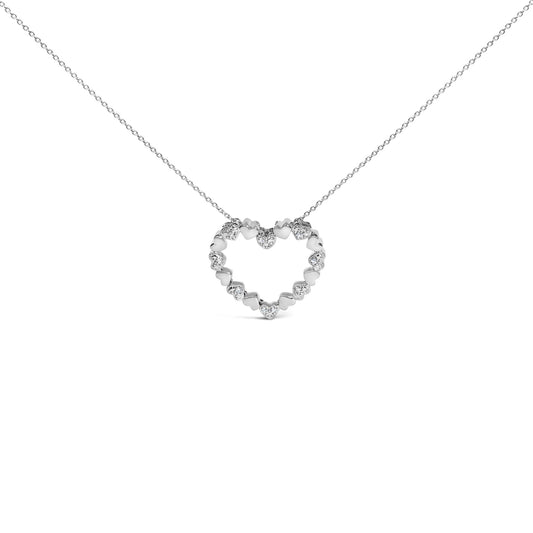 Close-up front view of a white metal necklace with a heart-shaped pendant made of alternating solid hearts and hearts set with white gemstones in a pave setting, shown on a white background.