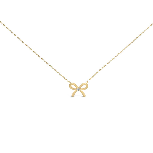 Yellow necklace with a bow-shaped pendant featuring a round white gemstone in the center, shown in a front-facing close-up angle.