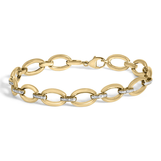 Yellow metal bracelet with oval links, some featuring white gemstones in pave setting, shown flat from a top front angle.