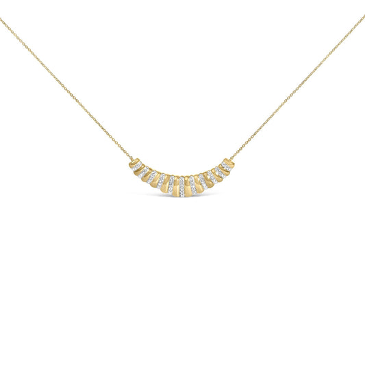 Close-up front view of a yellow necklace with a curved pendant featuring alternating sections of smooth metal and rows of white gemstones in pave setting, shown on a white background.