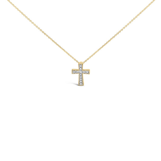 Front angled close-up of a yellow metal necklace with a cross pendant adorned with white round gemstones in prong settings.