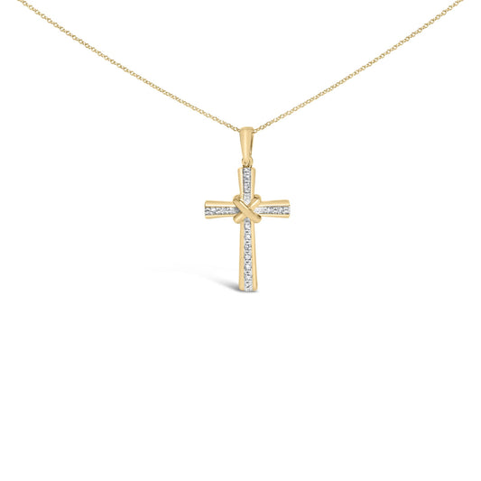 Front angle of a yellow necklace pendant in the shape of a cross with a knot detail in the center, featuring white round gemstones in a pave setting along the cross bars.