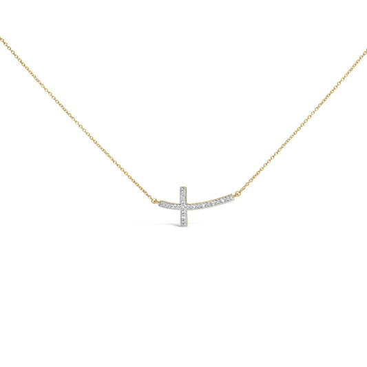 Front angle view of a yellow metal necklace with a sideways cross pendant adorned with round white gemstones in prong settings.