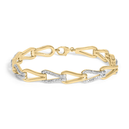 Close-up front view of a yellow metal bracelet with large linked shapes, some adorned with white gemstones in a pave setting, shown on a white background.