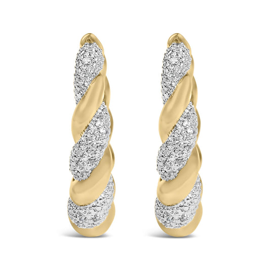 Close-up front view of yellow metal earrings twisted with pave-set white round gemstones.
