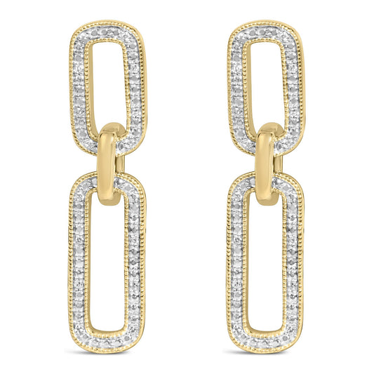 Close-up front view of yellow metal earrings featuring linked elongated oval shapes paved with white round gemstones around the edges.