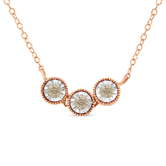Front angle close-up of a two-toned necklace with three round champagne-colored gemstones in miracle settings connected by a delicate chain.