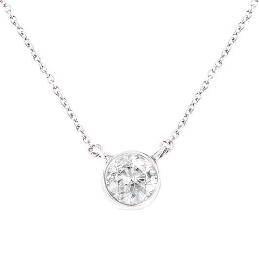 Close-up front view of white metal necklace with a round white gemstone in a bezel setting centered on the chain.