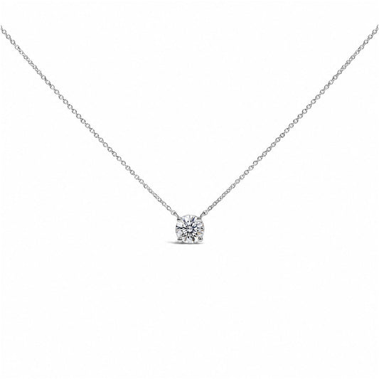 Close-up front view of a white metal necklace with a single round white gemstone in a four-prong setting hanging from a delicate chain, shown on a white background.