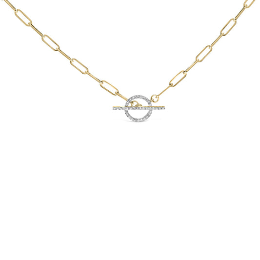 Front-facing shot of a yellow metal necklace with a toggle clasp adorned with white round gemstones in prong settings.