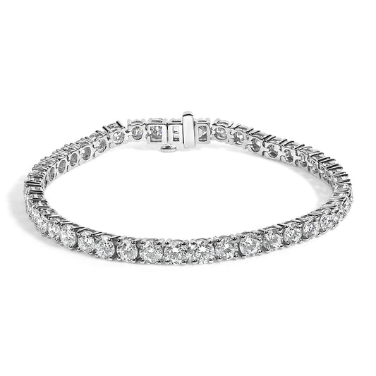 White metal bracelet with round white gemstones in 4-prong settings, shown in a front angled view.