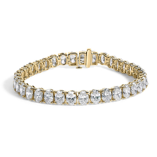 Yellow metal bracelet with oval-shaped white gemstones in 4-prong settings, shown from a front angled view.