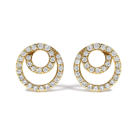 Pair of yellow metal circular earrings with an open swirl design set with round white gemstones, shown from a front angle on a white background.