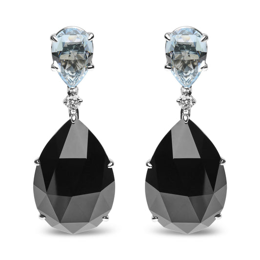 Front view of white metal drop earrings with pear-shaped blue gemstones at the top, small round white gemstones in the middle, and large pear-shaped black gemstones at the bottom.