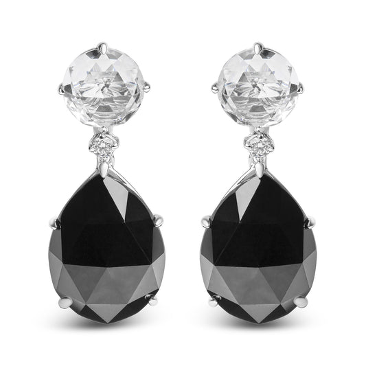Front-facing image of white metal earrings with round white gemstone at the top, small round white gemstone below it, and large pear-shaped black gemstone at the bottom, all in prong settings.