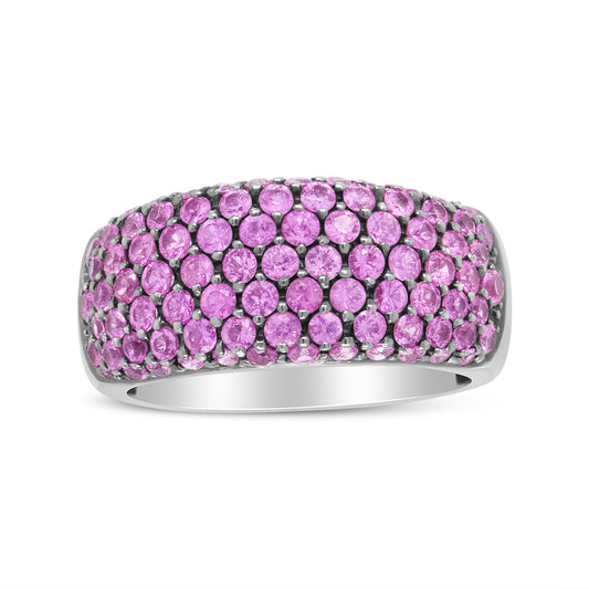 White ring with multiple round pink gemstones in prong settings, front-facing view on a white background.