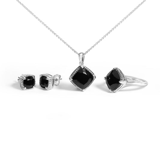 Set of jewelry including a necklace with a cushion-shaped black gemstone pendant, matching cushion-shaped black gemstone earrings, and a ring with a cushion-shaped black gemstone, all shown from a front and side angle on a white background.