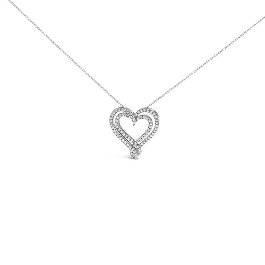 Front view of a white metal heart-shaped necklace pendant adorned with white round gemstones in a shared prong setting, displayed against a white background.
