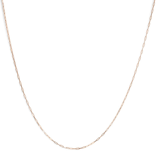 Close-up front view of a delicate rose chain with elongated links laid flat on a white background.