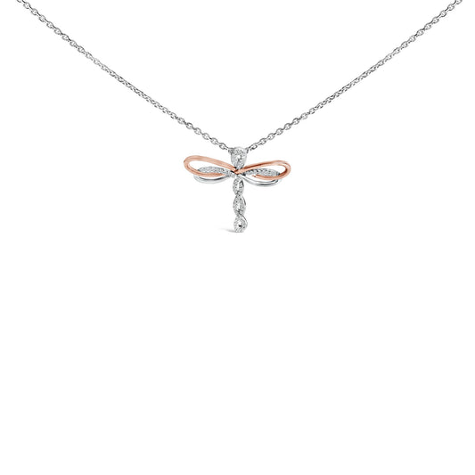 Front view of a necklace with a pendant shaped like a dragonfly featuring white and rose metal loops and round white gemstones in a pave setting hanging from a white metal chain.