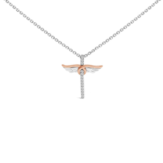 Front-facing close-up of a white and rose metal necklace pendant with wings, featuring white round gemstones in a shared prong setting on the vertical element and bail.