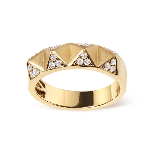 Close-up front angle of a yellow ring featuring geometric pyramid shapes accented with clusters of white round gemstones in a pave setting.