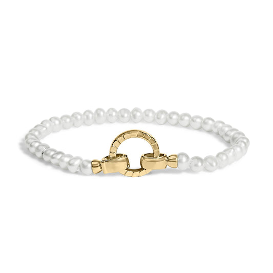 Bracelet shown from front angle featuring white round beads with a yellow metal circular clasp.